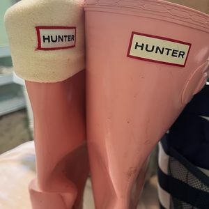Pink tall Hunter boots with boot liner.